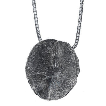 Large butthole pendant by Alligator Jesus